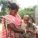 Monju Soren and her friends daughter, Promila (of India) collect clean water from a submersible pump.
